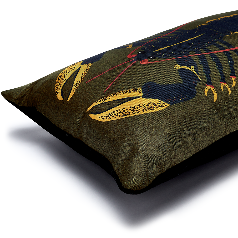 Blue lobster on green cushion