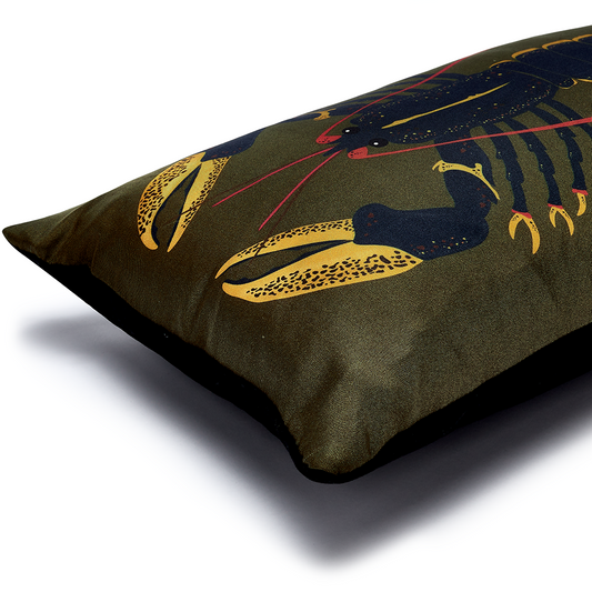 Blue lobster on green cushion